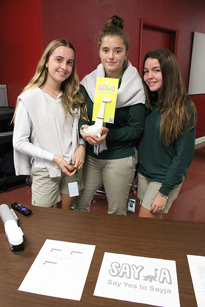 Immaculata-La Salle High sophomores Natalia Rosell, Romina Gutierrez-Zamora and Maite Ordorica, students in the marketing program, pose with their innovative ladle Sayja. The students teamed up with other classmates in the school's cross curricular project competition and won first place. In November, they presented their project to fellow students at the school's STEAM Day celebration exhibit.