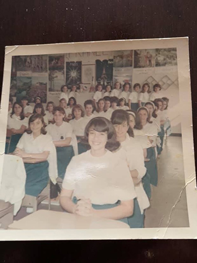 Elsa Reus, second from right, front, and former classmate Vivian Toscano, seated behind her, can be seen in this picture from their days as students in Mrs. Hermo's French class, 50 years ago at Notre Dame Academy in Miami. The alums made a return trip to their alma mater - now the Pierre Toussaint Haitian Center - Nov. 17, 2019.