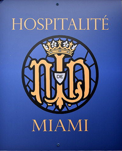 Hospitalité de Miami is so central to the mission at Our Lady of Lourdes Church, the group has its own meeting room, marked with a large plaque.