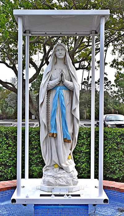 This statue of Mary is carried in monthly outdoor processions at Our Lady of Lourdes Church, Miami.