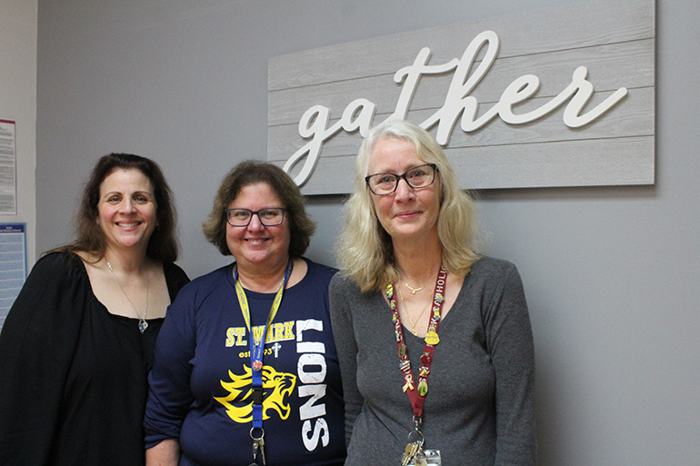 Love where you work, work where you love: Donna Villavisanis, Aida Kouri and Carol Thuijs have worked at St. Mark School and Church since the community was founded 25 years ago. Not only have they worked there, but their children and some of their grandchildren have also attended the school.