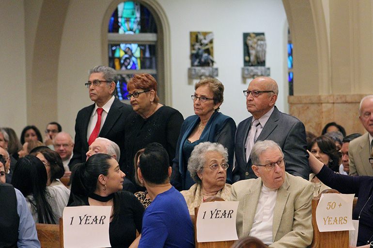 Couples celebrating 60 years or more of marriage stand and are recognized at the wedding anniversary Mass celebrated at St. Mary Cathedral Jan. 25, 2020.