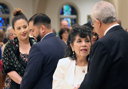 As on the day of their wedding, couples hold hands and face each other as they renew their marriage vows at the wedding anniversary Mass celebrated at St. Mary Cathedral Jan. 25, 2020.