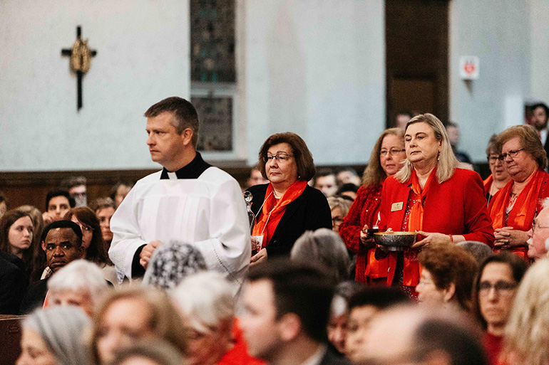 Members of the diocesan Councils of Catholic Women, including Miami's president, Lisa Shelly, front left, take up the offertory during the 45th annual Red Mass of the Holy Spirit which concluded the 2020 Catholic Days at the Capitol.