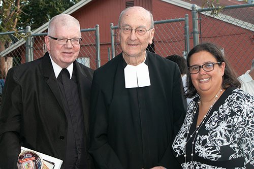 Posing after the ceremony, from left: Lasallian Brother Dennis Lee, superior of the Eastern North America district; Brother Rodolfo Meoli, general postulator for the Lasallian Brothers, visiting from Rome; and Monica Lauzurique, director of the La Salle Educational Center.