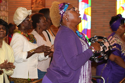 Participants join in to praise and worship the Lord during
Revival 2020's opening night, Feb. 16 at Holy Redeemer Church in Miami.