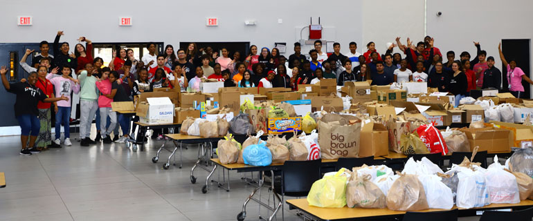 Msgr. Edward Pace High students gather for a group shot after packing over 3,500 meals for the homeless. The efforts come as part of the pre-Lenten event Hungerfest, where participants combine their own fasting with prayers and meal prepping and packing.