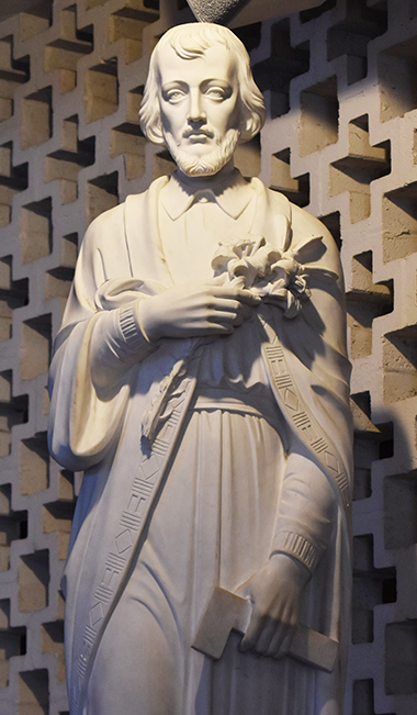 Statue of Joseph is on the other side of the chancel at St. Rose of Lima Church, Miami Shores. The hammer in his left hand shows his vocation as a carpenter.