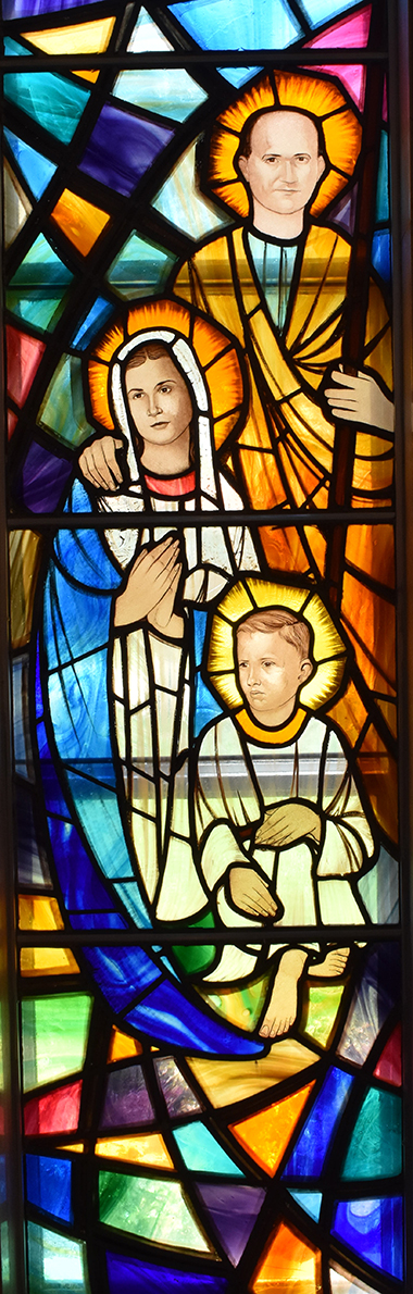 The religious store windows at St. Rose of Lima, Miami Shores, show old-style themes, but with modern faces. Here's a rendering of the Holy Family.