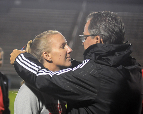 Cardinal Gibbons athletic director Michael Morrill, right, gives Chiefs girls soccer head coach Margo Flack a silver medal for her team's runner-up finish in FHSAA Class 4A girls soccer. The Chiefs fell to Jacksonville Bishop Kenny 2-1 in the 4A girls final, Feb. 26, 2020, at Spec Martin Stadium in DeLand.