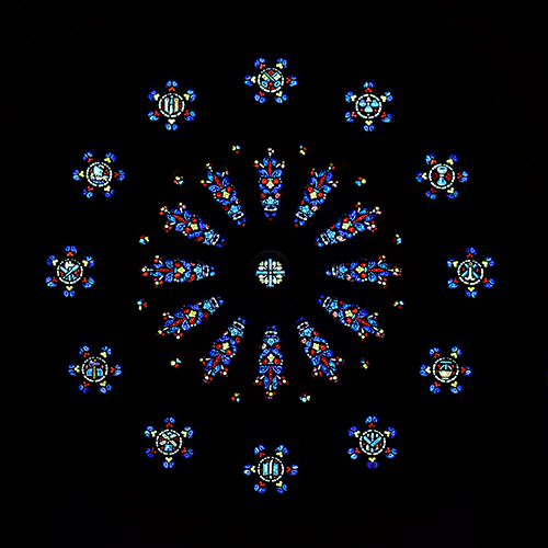 The rose window at St. Patrick Church resembles an ornate flower with 12 petals.
