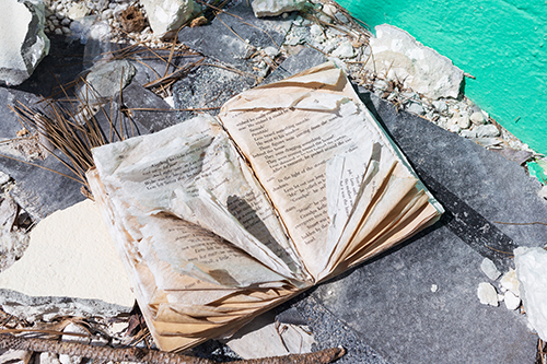 A book lies in the debris of St. Francis de Sales School in Abaco, which was closed following last year's devastating Category 5 Hurricane Dorian. The school is expected to be rebuilt but students and faculty have been relocated throughout The Bahamas.