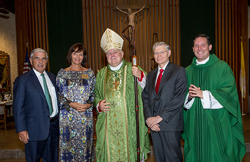 Ed and Amy Easton, left, pose with Archbishop Thomas Wenski, Legatus creator Thomas Monaghan and Father Richard Vigoa after the chartering Mass for the Miami Legatus chapter, Feb. 20, 2020, in St. Augustine Church, Coral Gables.