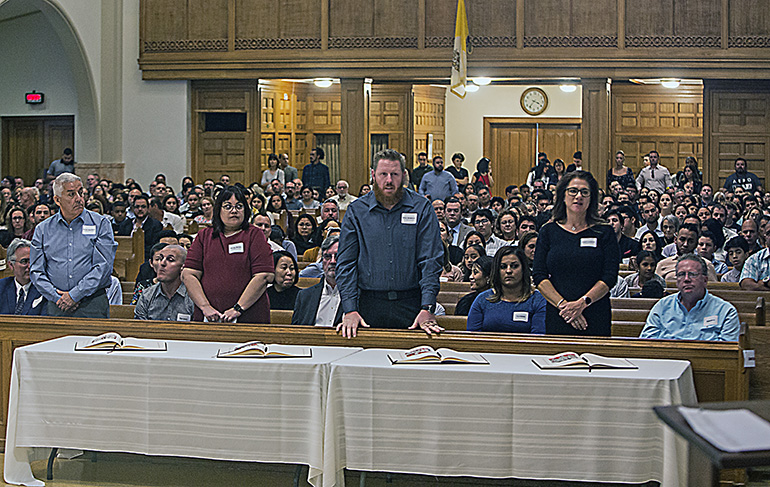 St. Elizabeth Ann Seton catechumens stand as Archbishop Thomas Wenski recognizes the groups from different churches during one of the two Rite of Election ceremonies celebrated March 1, 2020, at St. Mary Cathedral.