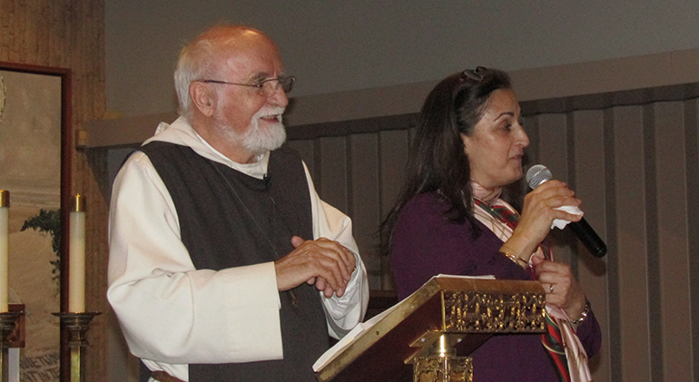 With the aid of a translator, Father Jacques Philippe speaks about families and the Beatitudes at St. Augustine Church in Coral Gables, March 6, 2020. He is a retreat master, speaker, and author of modern spiritual classics, with more than one million books sold and translated into 24 languages.