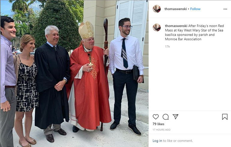 Archbishop Thomas Wenski poses for photographs after celebrating the annual Red Mass for legal professionals in Monroe County, March 6, 2020, at the Basilica of St. Mary, Star of the Sea, in Key West.