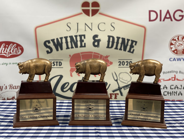 Three little piggy trophies wait to be awarded at the St. John Neumann School Swine and Dine Pork Roast Cook-off and Bazaar on Feb. 22.