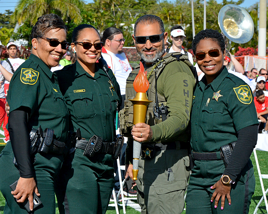 Members of the Broward Sheriff's Office show the Flame of Hope, used March 7 at the start of the Special Olympics Florida Broward County Games.