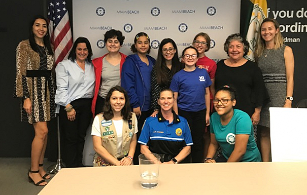 Madeleine Gonzales, lower left, poses with others in the Miami Beach leadership program. Madeleine, a senior student at Msgr. Edward Pace High School, has won a scholarship from the National Honor Society.