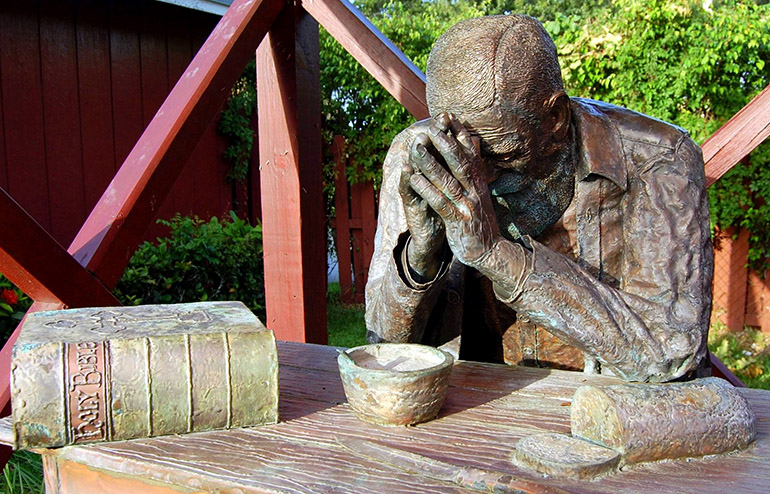 This bronze statue is a rendering of the picture "Grace," snapped in 1918 by photographer Eric Enstrom of Bovey, Minnesota. The life-size statue stood on the grounds of St. Maurice, but was stolen sometime after 2014.