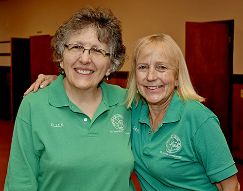 Ellen Volpicella, left, and Joanne Leahy join in aiding the poor and homeless for St. Maurice Church.