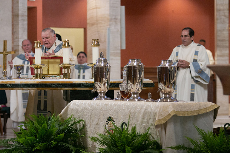 Archbishop Thomas Wenski, alone with the deans of the archdiocese, several bishops and priests, and two deacons, celebrates the Mass of Chrism in the midst of the coronavirus pandemic, on the Tuesday of Holy Week, April 7, 2020, at St. Mary Cathedral. The Mass was livestreamed on the Archdiocese of Miami's Facebook and YouTube sites.