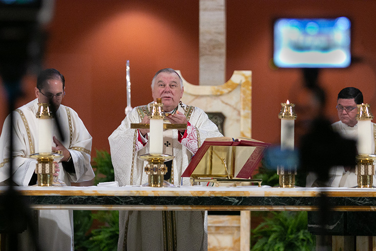 In an empty St. Mary Cathedral, Archbishop Thomas Wenski pre-records an Easter Sunday Mass to be aired by WSVN-7 at 11 a.m. April 12.