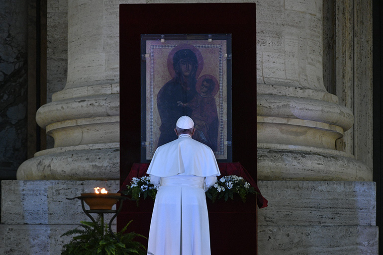 Pope Francis prays before the Byzantine icon of Mary as Salus Populi Romani during a televised holy hour with Eucharistic adoration and an extraordinary Urbi et Orbi blessing in an empty St. Peter's Square, in response to the coronavirus pandemic, March 27, 2020.