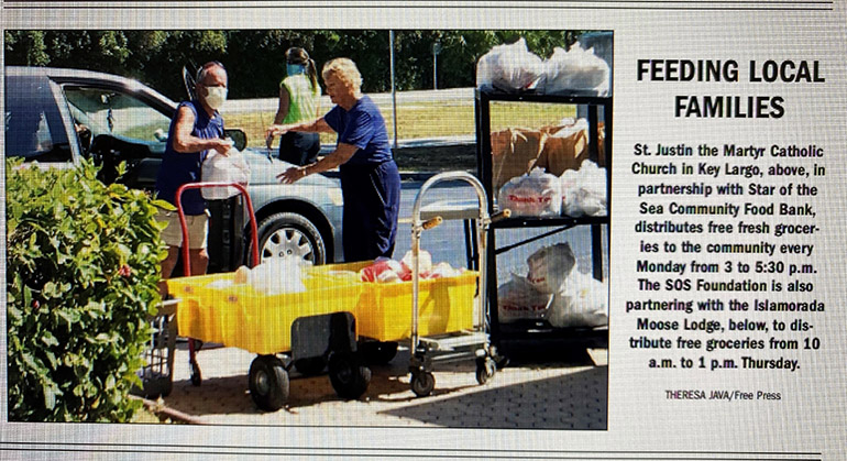 Image of St. Justin Martyr volunteers distributing food from the church's pantry was published recenly in the local paper, The Free Press.