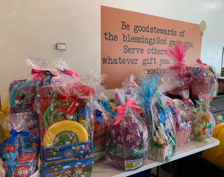 Easter baskets donated by St. Mark School students wait to be collected by families at New Horizon Methodist Church, neighbor to St. Mark Church in Southwest Ranches.