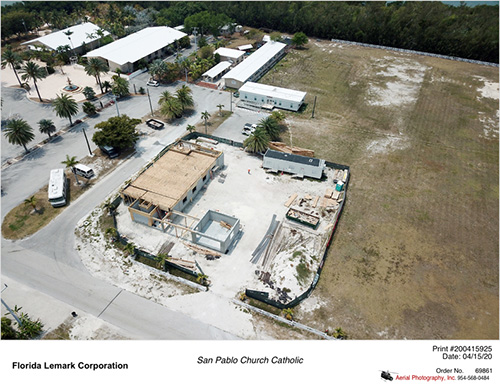 Aerial view, taken April 15, 2020, of the new rectory and office for San Pablo Church in Marathon, which is being built to replace the one damaged by Hurricane Irma in 2017. The church, which was not damaged, is visible at top left.