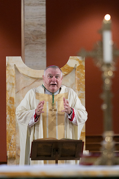 Archbishop Thomas Wenski greets graduates at the start of a baccalaureate Mass for all members of the Archdiocese of Miami's high school graduating class of 2020. The Mass was celebrated May 19, 2020 and livestreamed on the Archdiocese of Miami's website and Facebook page. Due to the coronavirus pandemic, only the superintendent of schools, Kim Pryzbylski, and the associate superintendent, Donald Edwards, were present.