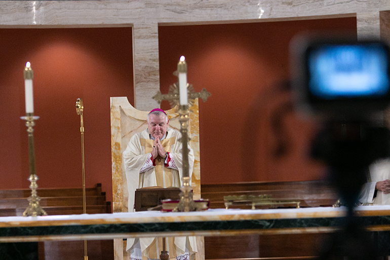 Archbishop Thomas Wenski celebrates a baccalaureate Mass for all members of the Archdiocese of Miami's high school graduating class of 2020. The Mass was celebrated May 19, 2020 and livestreamed on the Archdiocese of Miami's website and Facebook page. Due to the coronavirus pandemic, only the superintendent of schools, Kim Pryzbylski, and the associate superintendent, Donald Edwards, were present.