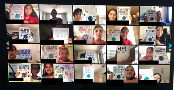 Via a Zoom meeting, students from St. Hugh School show off colorful flyers they made, which will accompany their COVID-19 time capsules.