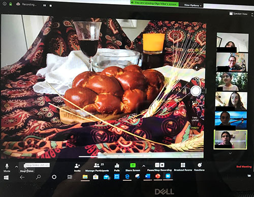 A teacher from St. Hugh School shares with students the views of a recreated last supper, with bread and wine, and water and a cloth to signify the washing of the feet.