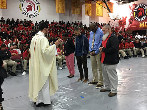 Father Bryan Garcia blesses Pace teachers who went to Haiti on a mission trip in 2017. In praising the Supreme Court's July 8, 2020 decision, Archbishop Thomas Wenski noted that "education is a central aspect of the Church’s mission. Indeed, teaching is one of the Spiritual Works of Mercy."
