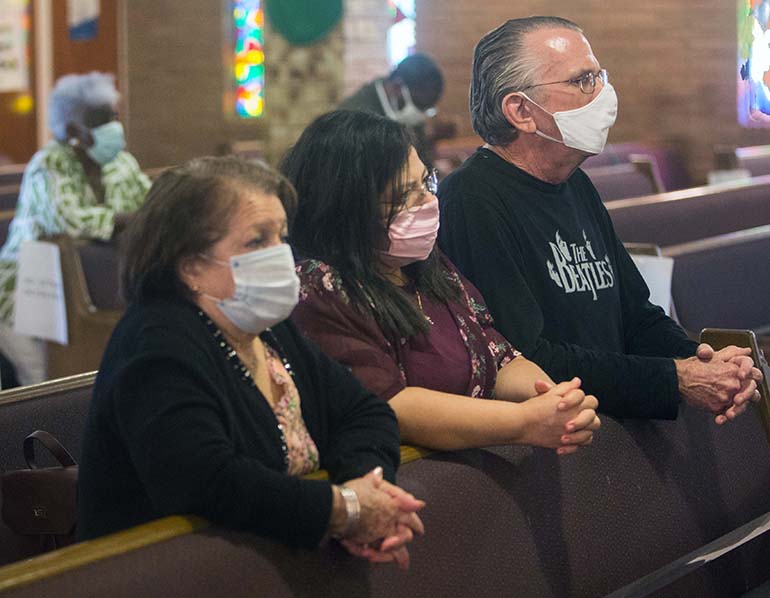 Nancy Blanco, Elaine Kennedy and Edward Kennedy came from Kendall to attend the Mass for unity against racism and for peace, celebrated by Archbishop Thomas Wenski July 5, 2020, at Holy Redeemer Church in Liberty City.