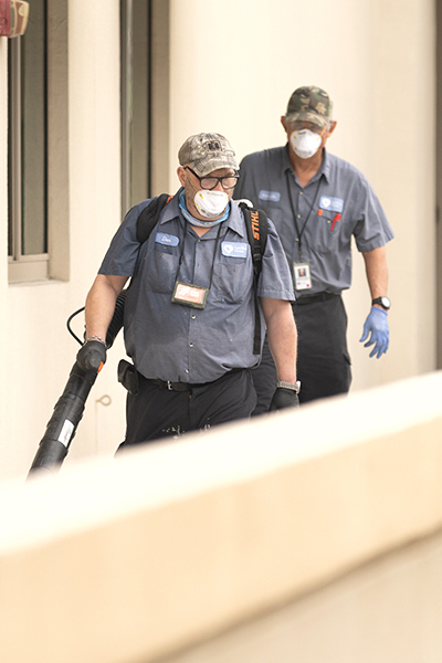 Staff members at Camillus House shelter for the homeless in Miami sanitize the facility in advance of the July 23, 2020 visit of Dr. Jerome Adams, the 20th U.S. surgeon general.