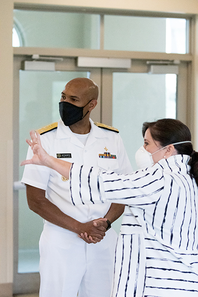 Dr. Jerome Adams, the 20th U.S. surgeon general, talks with Hilda Fernandez, CEO of Camillus House shelter for the homeless in Miami, during a visit to South Florida on July 23, 2020.