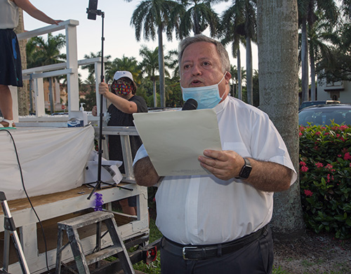 Father Juan Sosa, pastor of St. Joseph Church on Miami Beach, closes PACT's drive-in rally with a prayer, July 27, 2020.