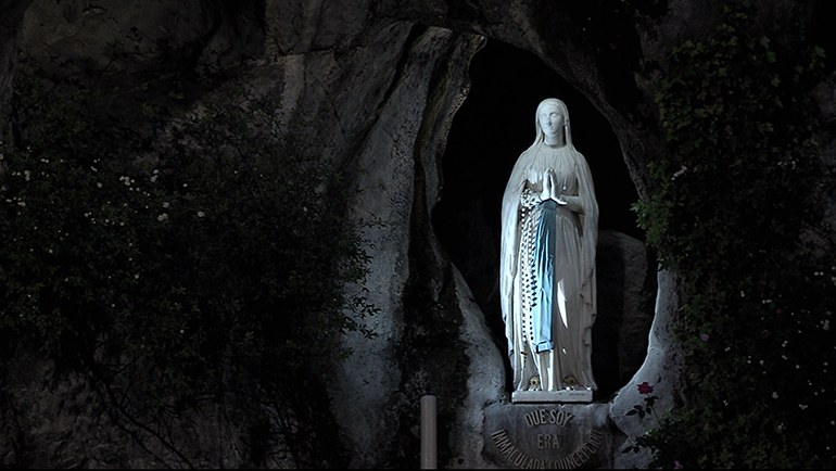 A statue of Our Lady of Lourdes in the grotto at the shrine of Our Lady of Lourdes in Lourdes, France. She is believed to have appeared to St. Bernadette Soubirous in 1858 as the "Immaculate Conception."
