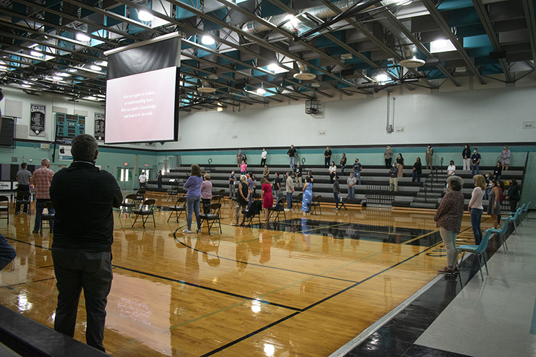 Socially distanced teachers take part in Mass at Archbishop McCarthy High in Southwest Ranches at the start of the 2020-2021 academic year.