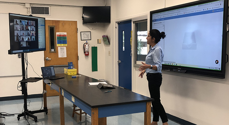 A Lourdes Academy teacher conducts virtual classes on the first day of school, Aug. 19, 2020. All the classrooms at the high school have been equipped with 50" Amazon Fire TVs, which are connected to new laptops -- all intended to facilitate the teaching and learning process during virtual classes.