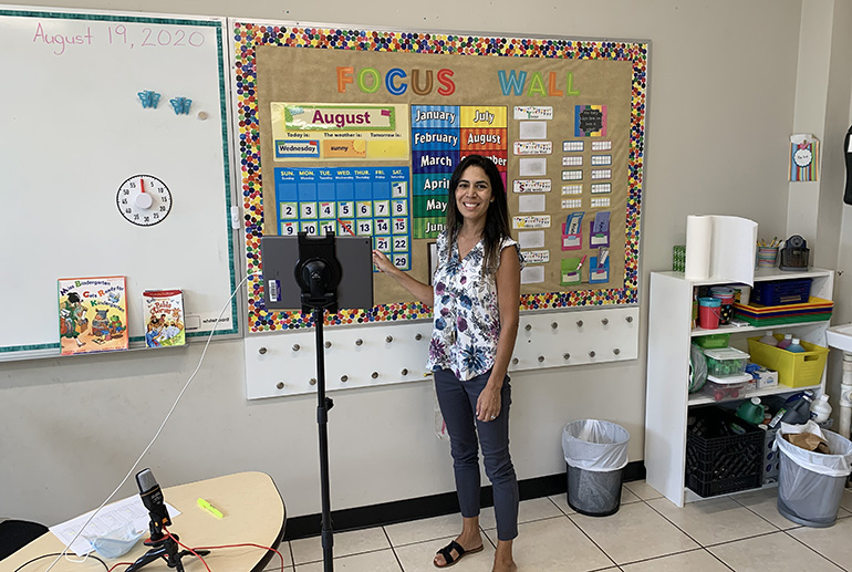 Nativity School kindergarten teacher Melissa Butera teaches a lesson via iPad on the first day of school, Aug. 19, 2020. PreK students were allowed to resume in-person classes at archdiocesan schools, while K-12 students returned only virtually.