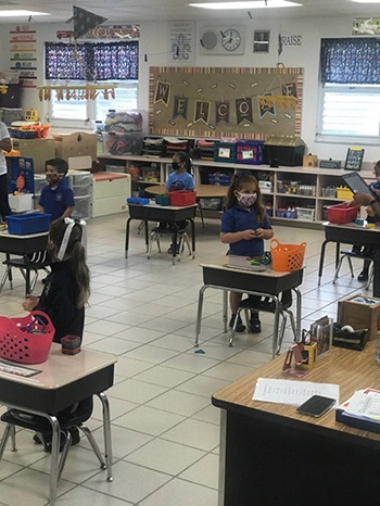 Photo of a socially distanced PreK4 classroom at Our Lady of Lourdes School, Miami, on the first day of school, Aug. 19, 2020.