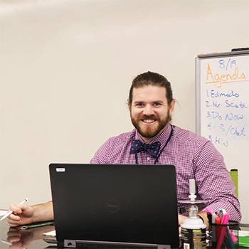 Keiffer Scott teaches AP Chemistry through a virtual platform on the first day of the 2020-2021 academic year at St. Brendan High School in Miami.