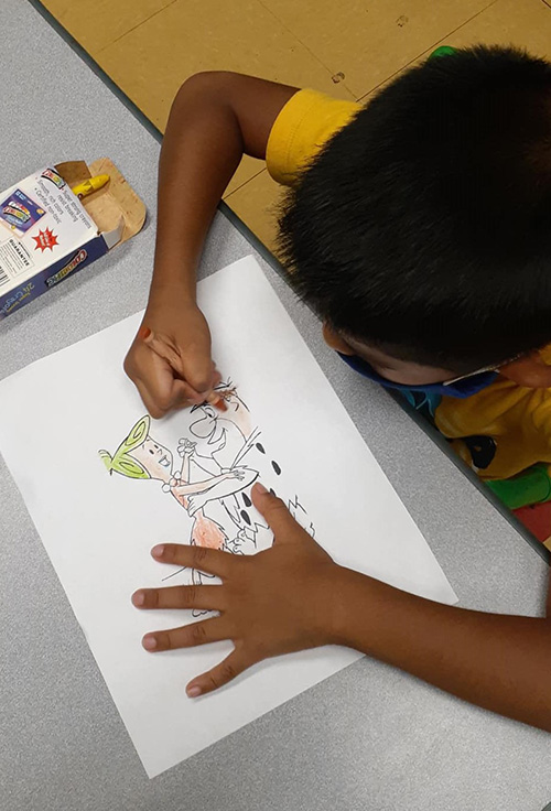 Flintstones, meet the Flintstones: After learning about the American iconic animated show of the 1960s, summer campers at La Salle Educational Center colored in their own Fred and Wilma.