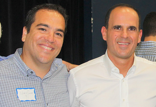 Mario Sueiras, left, and Marcus Lemonis, classmates from the Christopher Columbus High School class of 1991 and childhood friends, have pledged a significant amount toward the construction of a new science and arts center at the high school. The center will now be named after them.