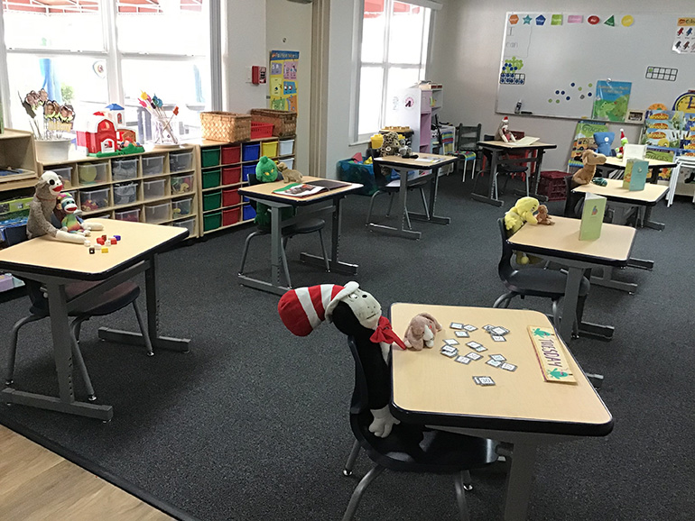 Stuffed animals fill the seats of Cindy Barry's Kindergarten class at St. Coleman School in Pompano Beach, Sept. 4, 2020. Barry added the stuffed animals at the suggestion of one of her students.