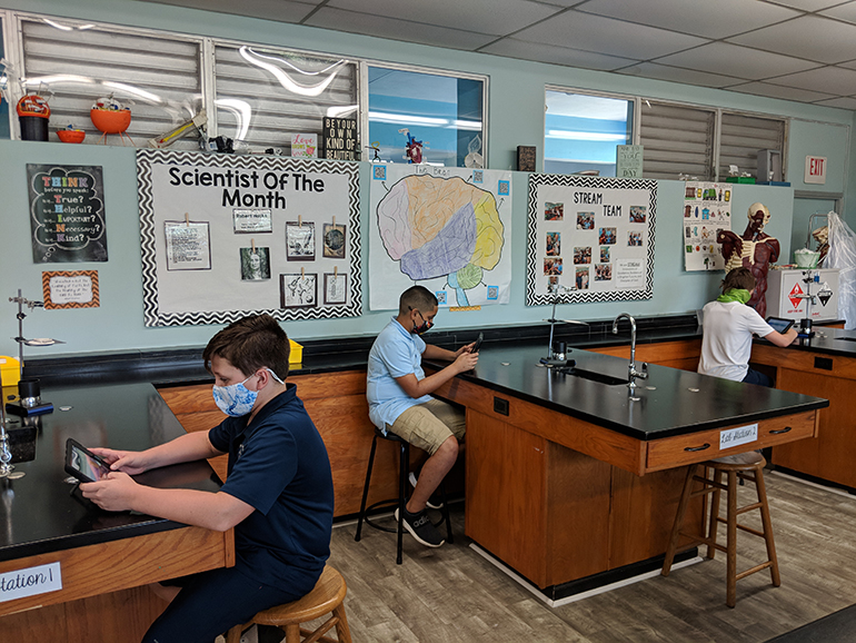 Students at the Basilica School of St. Mary Star of the Sea do some work in a science lab. The school just became one of only four in the Archdiocese of Miami, and nine in the state of Florida, to earn STREAM certification.